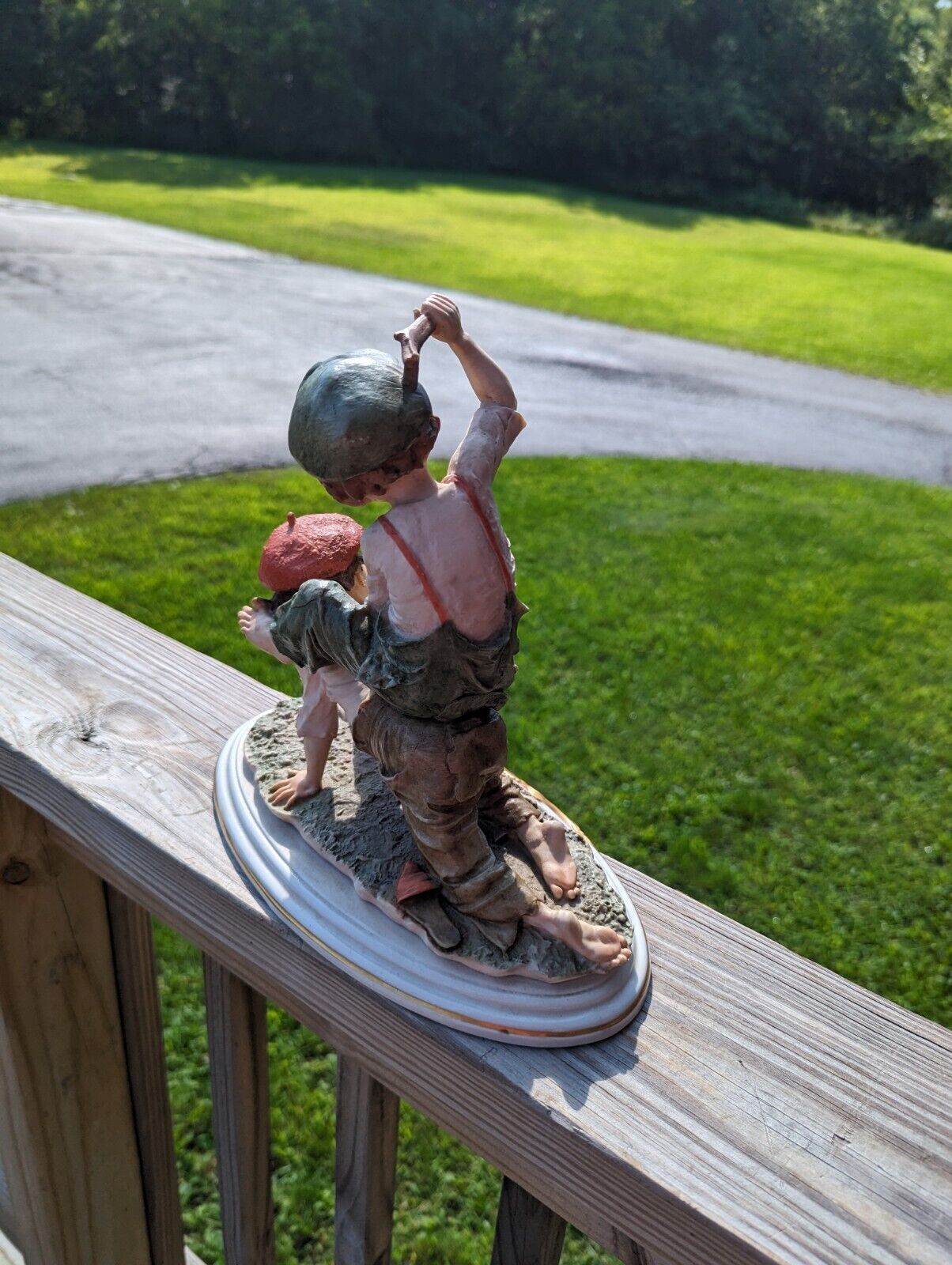 Vintage Girl Ridding Boy Signed Ceramic Figurine