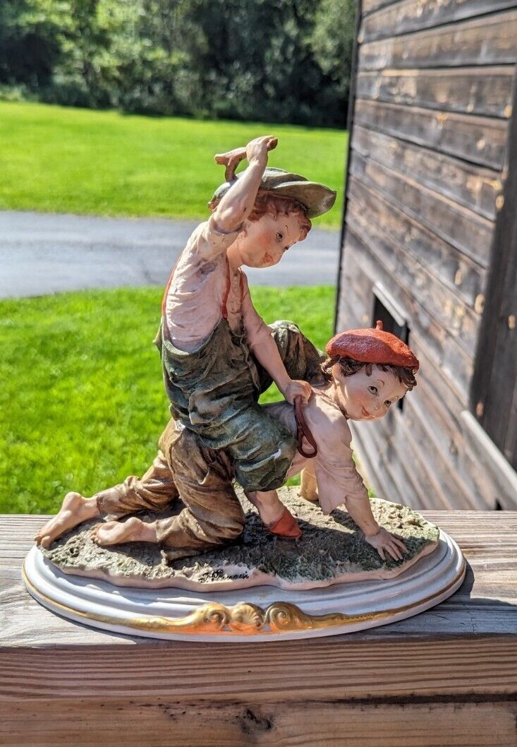 Vintage Girl Ridding Boy Signed Ceramic Figurine