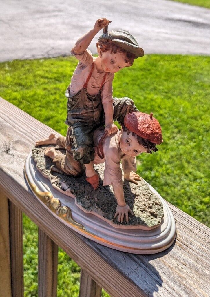 Vintage Girl Ridding Boy Signed Ceramic Figurine