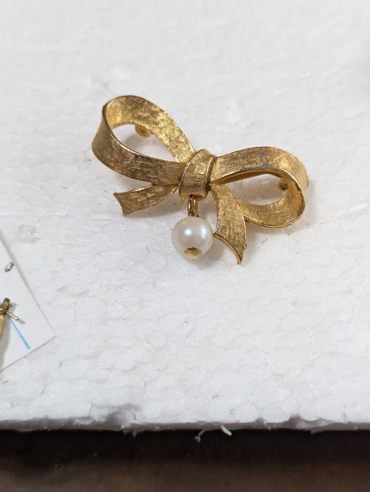 Vintage DUBARRY Gold Tone Ribbon With A Dangling Pearl