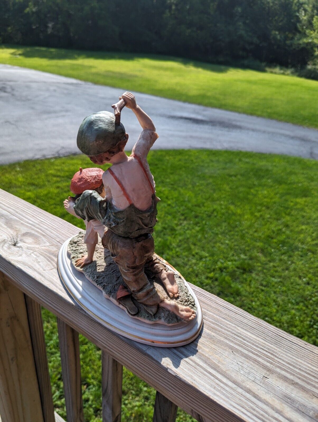 Vintage Girl Ridding Boy Signed Ceramic Figurine