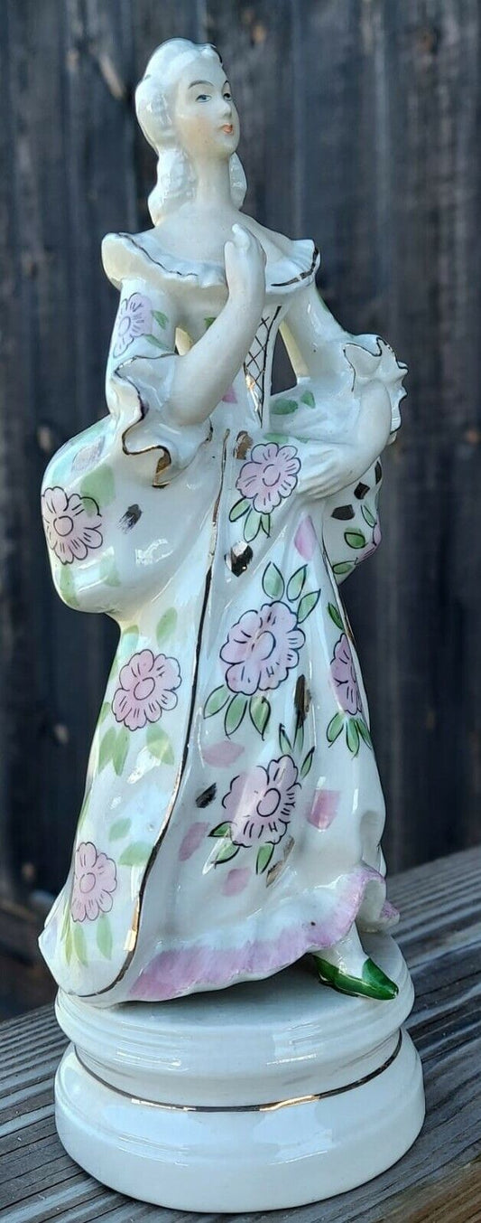 COLONIAL LADY FIGURINE, CREAM COLOR, PINK FLOWERS, GREEN, 9 1/2" TALL, GOLD TRIM