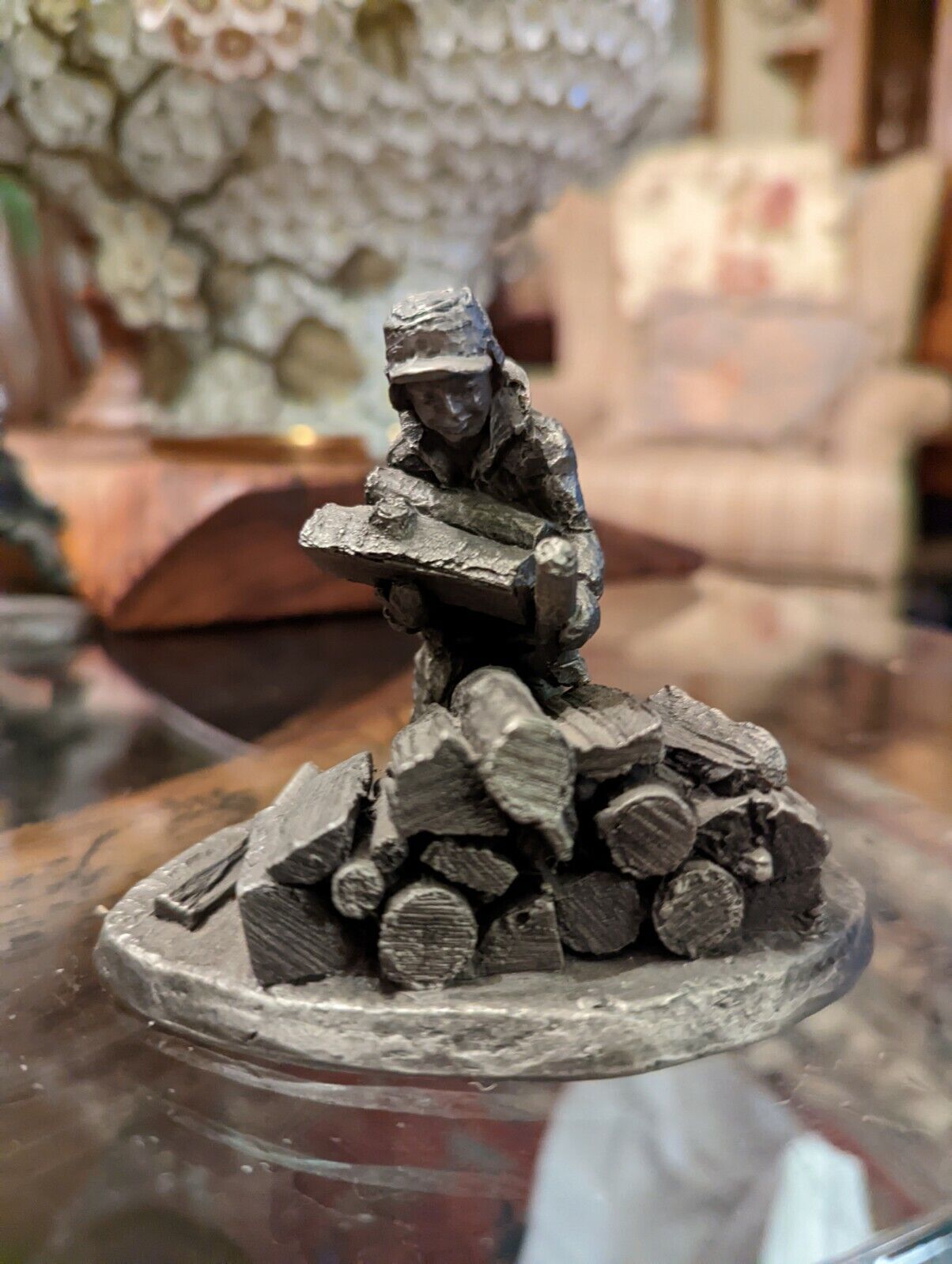 International Pewter Man Pilling Wood Logs Figurine