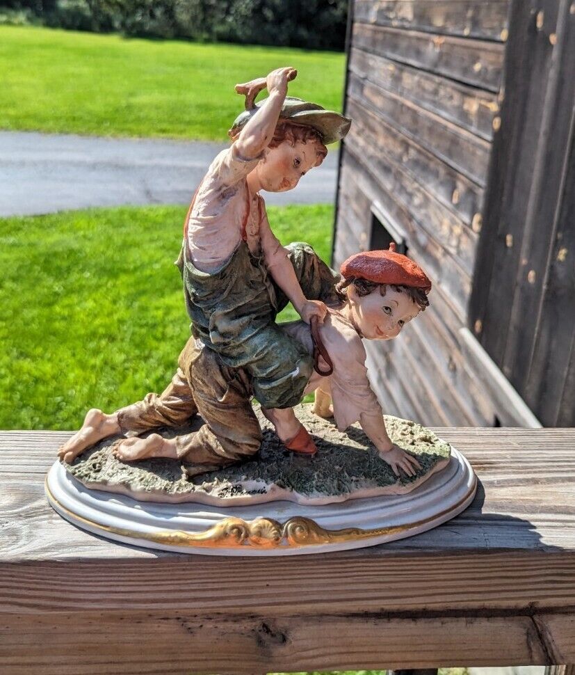 Vintage Girl Ridding Boy Signed Ceramic Figurine