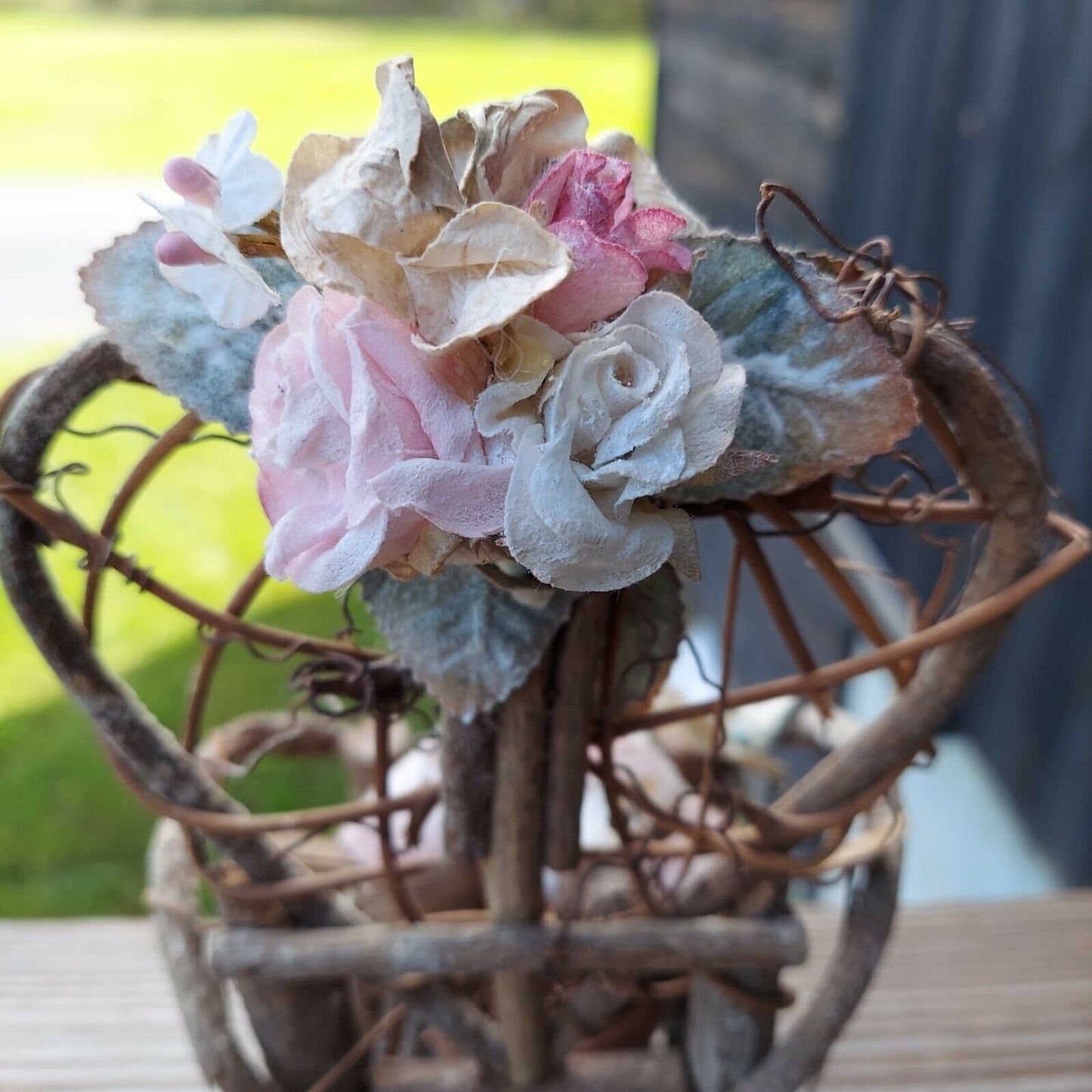 miniature wood garden chair with two birds on it